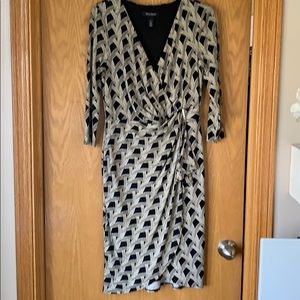 Black and ivory wrap dress gold buckle detail.